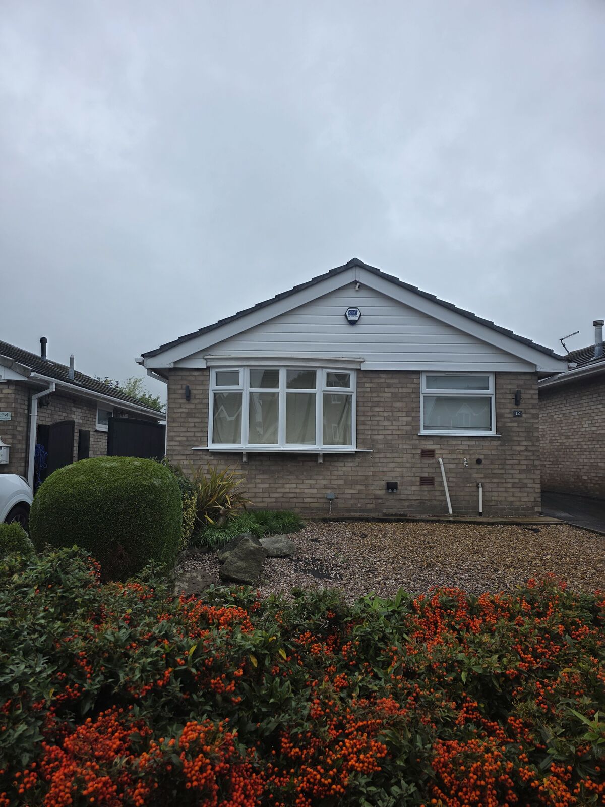 Bungalow front windows with clear glass before privacy tint was applied